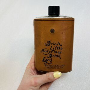 vintage leather-wrapped glass flask